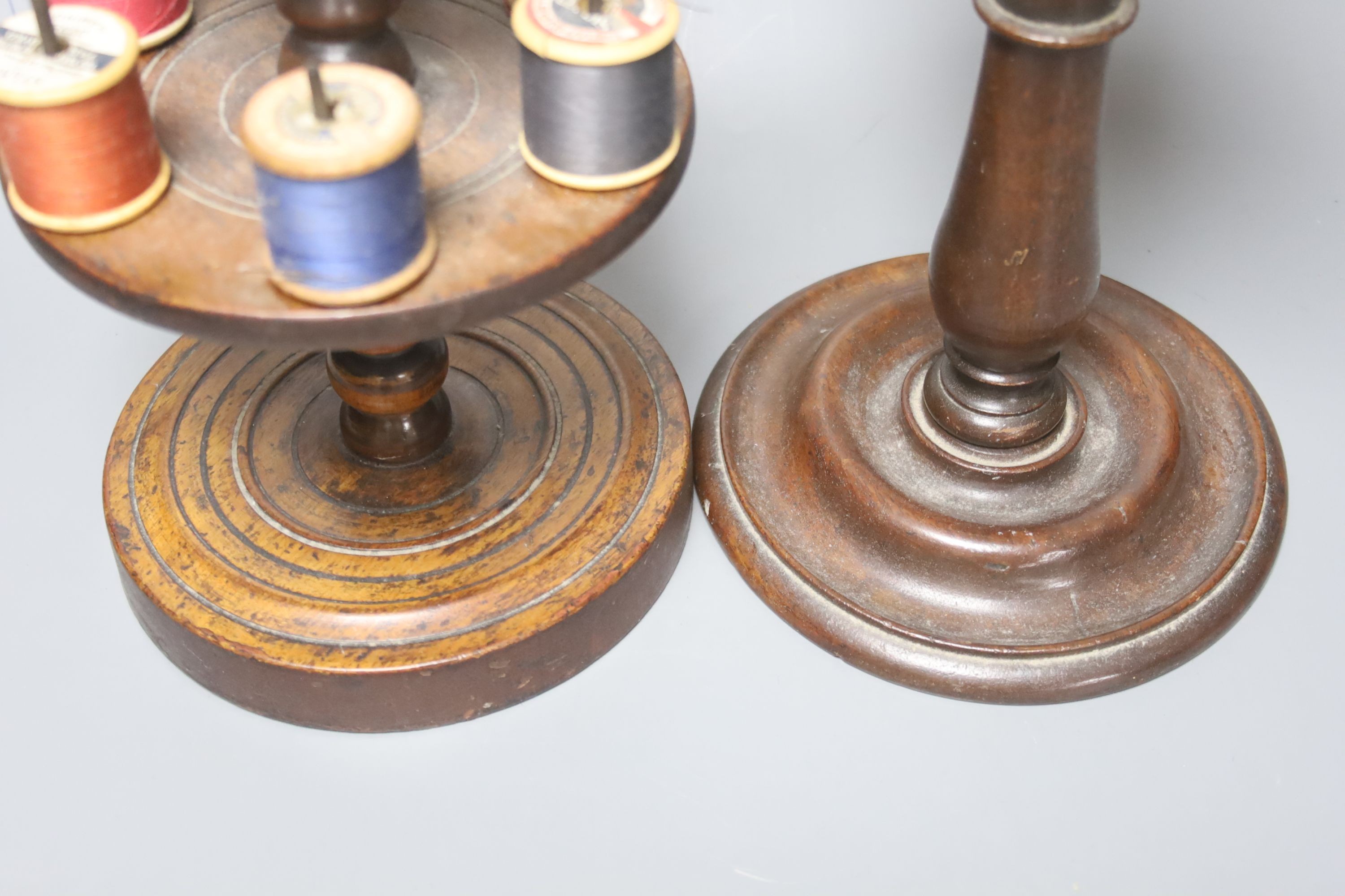 A Victorian turned wood cotton reel stand, 30cm and a 19th century mahogany telescopic candle stand, height 26cm